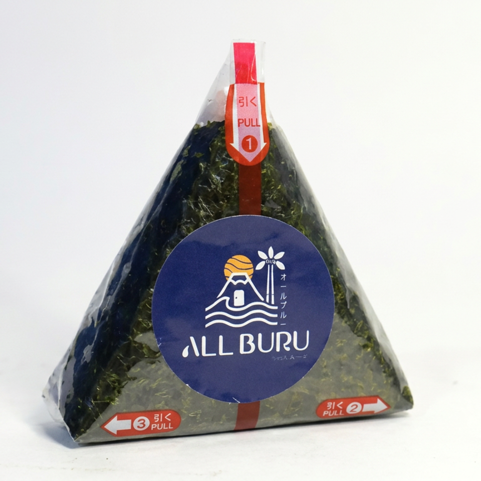 Triangular Japanese rice ball wrapped in seaweed and plastic packaging, labeled All Buru, with pull-tab opening instructions.